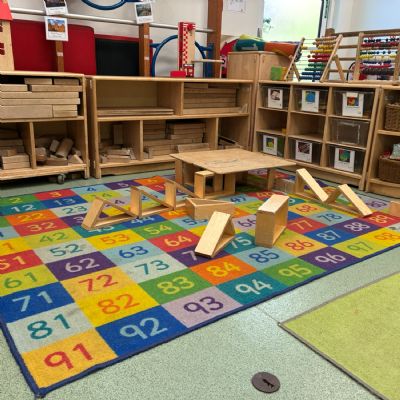 Blocks set out on a rug showing 1 to 100