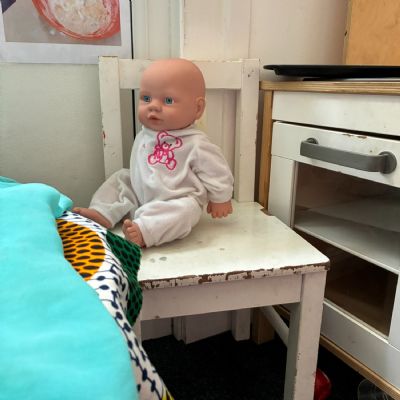 A doll waits in the 2-year-olds' room