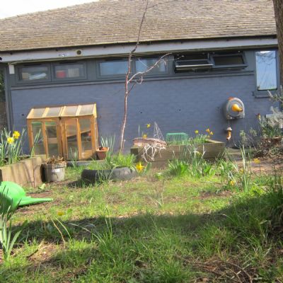 Looking at the wooden and glass cold frame 
